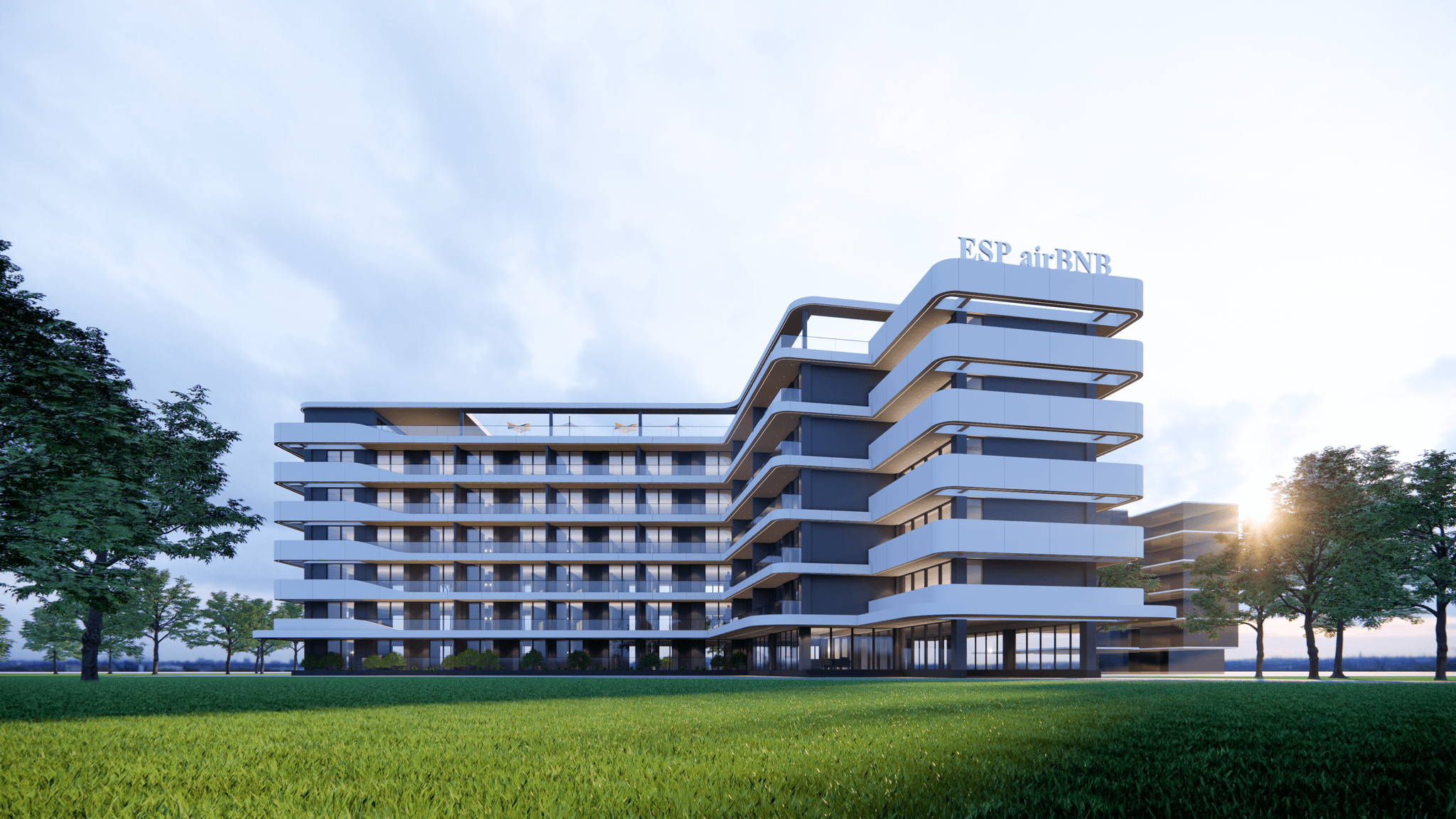 ESP Apartments building across a landscaped lawn at golden hour