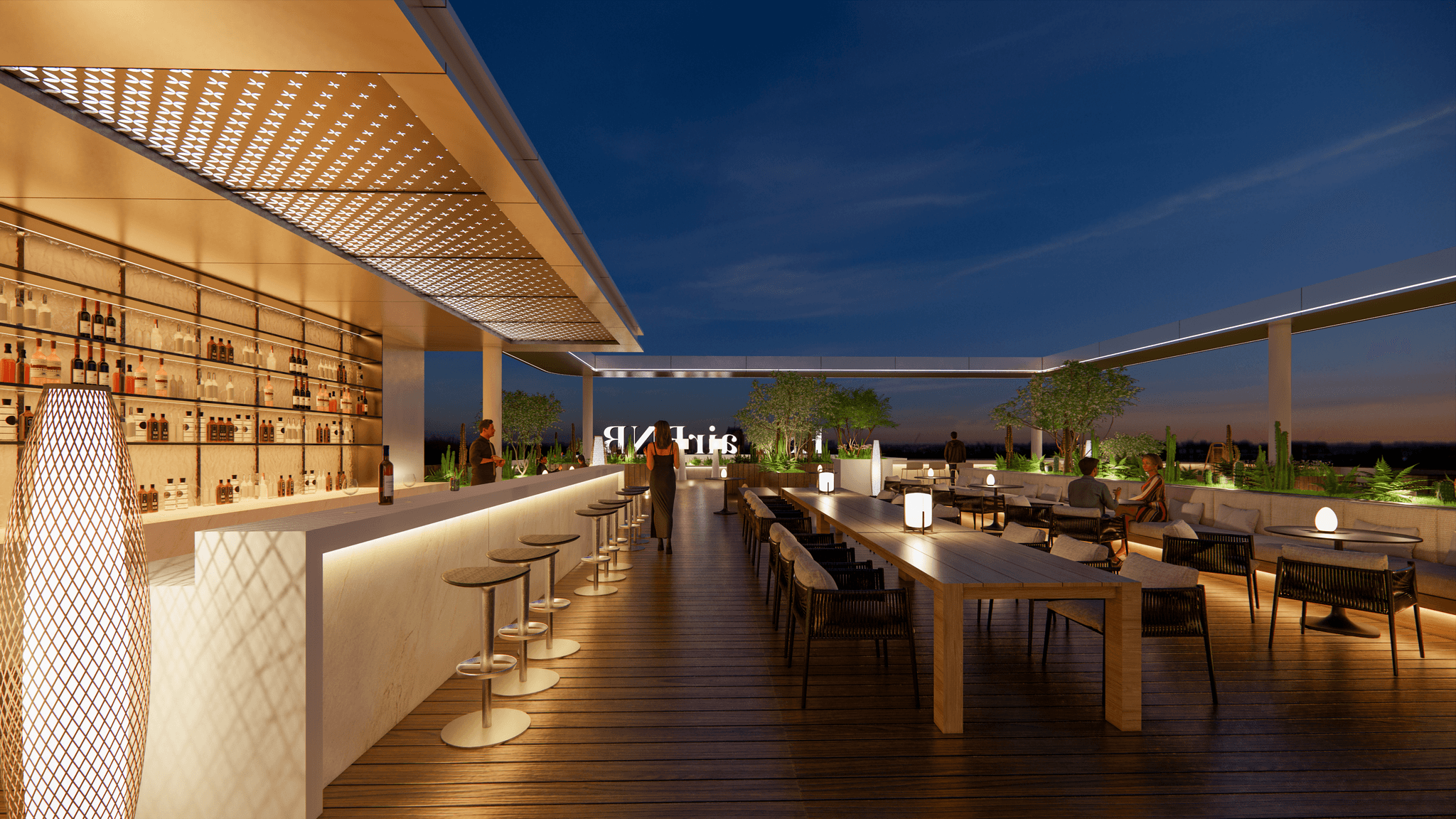 Wide night view of the ESP Apartments rooftop amenity deck